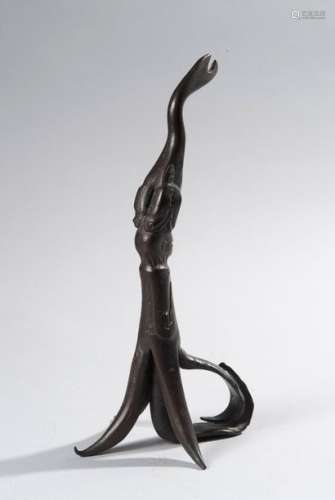 Bronze oil lamp base representing a fish biting the head of a character. Work in the taste of the 16th century.