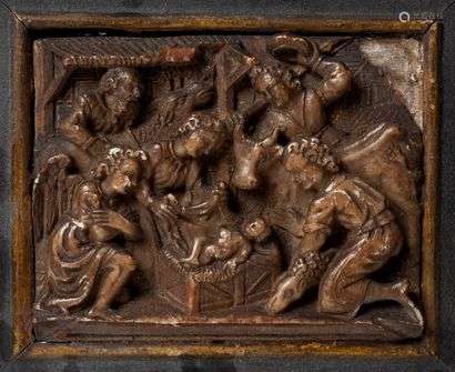 The adoration of the Shepherds, Alabaster plate carved in low relief, Traces of gilding, Workshops in Mechelen, end of the 16th century, 12.5 cm x 9.5 cm Accidents and restorations, in a blackened and gilded wooden frame.
