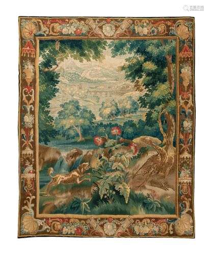 Royal Manufacture of Beauvais early 18th centuryTapestry decorated with a dog in the foreground running after a bird; a landscape crossed by a river in the background.233 x 204 cm(Wear and tear, weakened parts, restorations, small edge bend)
