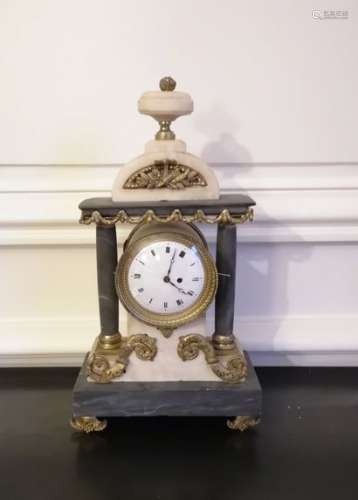 Clock with columns in turquoise blue and white marble, gilded bronze trim. Mechanism added Work around 1800High. : 31 cm
