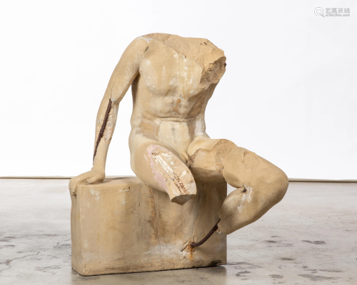 A Roman style cast stone seated torso sculpture