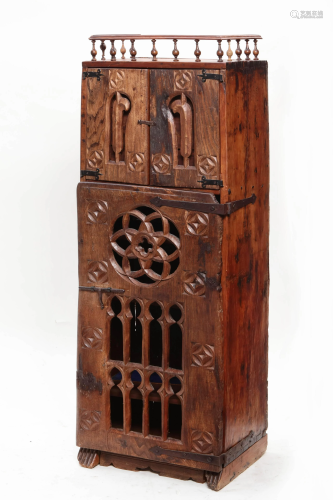 A Spanish carved oak cupboard