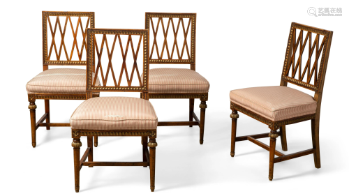 Four Neoclassical walnut dining chairs