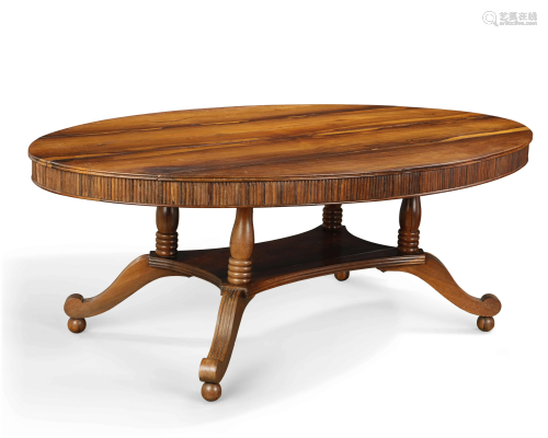 An Anglo-Indian exotic hardwood oval dining table