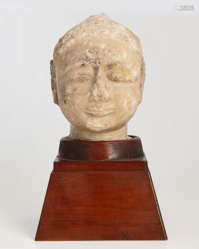 An Indian carved stone Jaina head