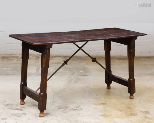 A Spanish Baroque style iron & wood library table