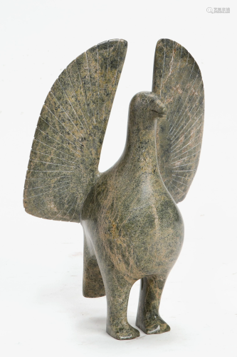 A carved stone model of a bird on pedestal