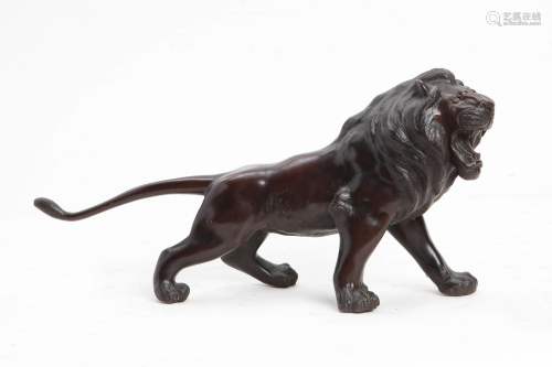 A Japanese bronze model of a standing lion