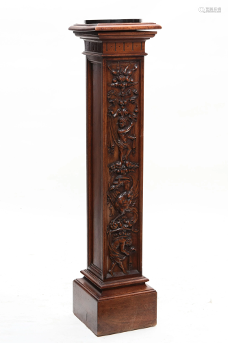 A Baroque style carved mahogany pedestal