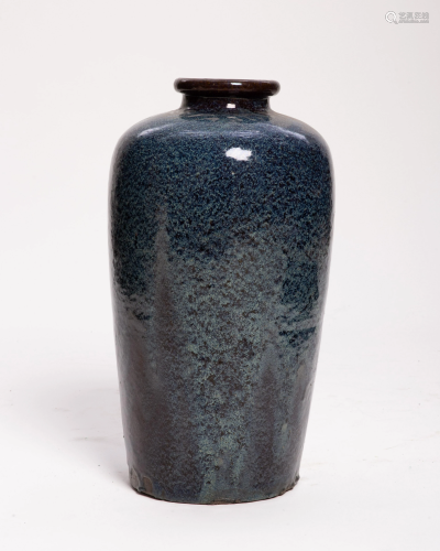 A glazed earthenware vase