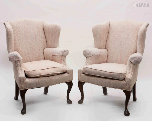 A pair of George II style wing armchairs