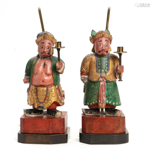 A pair of Chinese figural candlesticks now lamps