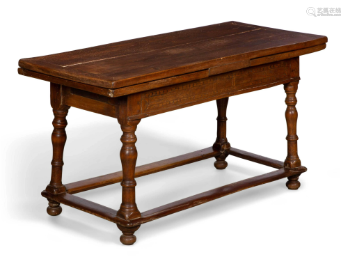 A Swiss Baroque mixed wood draw leaf table