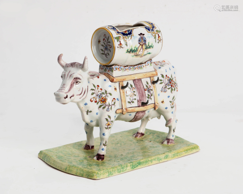 A French Faience model of a cow