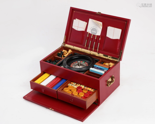 A vintage red leather cased game compendium