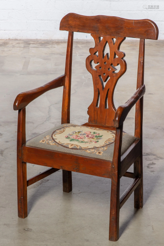 A Continental Baroque mixed wood armchair