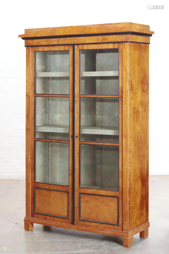 A Biedermeier parcel ebonized fruitwood bookcase