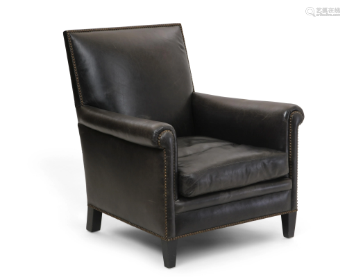 A brass studded leather upholstered club armchair