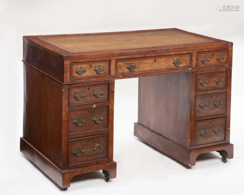 A Victorian walnut pedestal desk