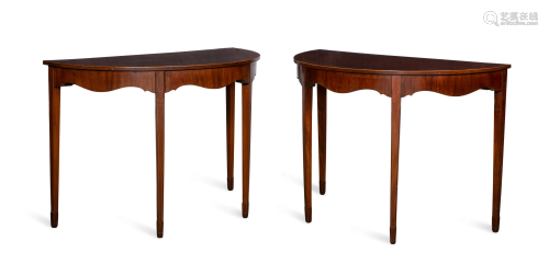 A pair of inlaid mahogany demilune side tables