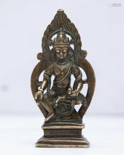 A Kashmiri gilt bronze figure of seated Buddha