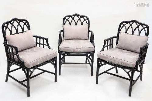 A set of three McGuire ebonized armchairs