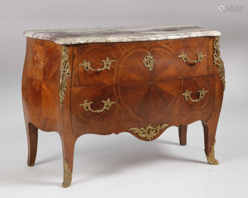 A Louis XV style gilt inlaid walnut commode