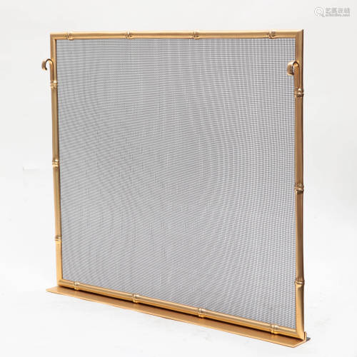 A gilt bronze and steel mesh fire screen