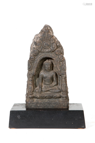 A Southeast Asian stone relief of seated Buddha