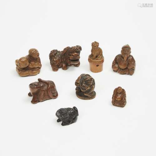 A Group of Eight Wood and Bamboo Carved Netsuke