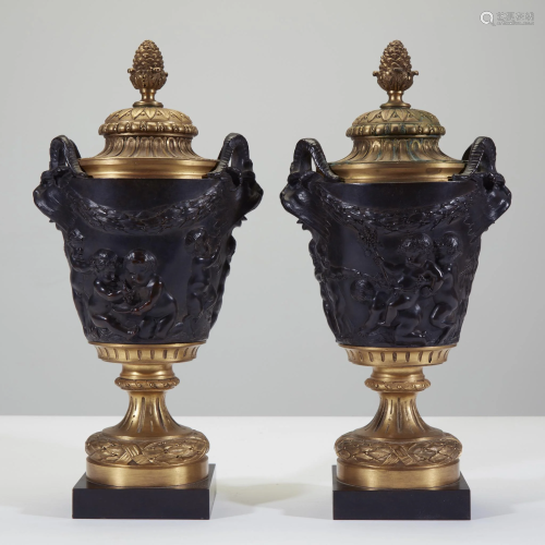A pair of Louis XVI style gilt and patinated bronze