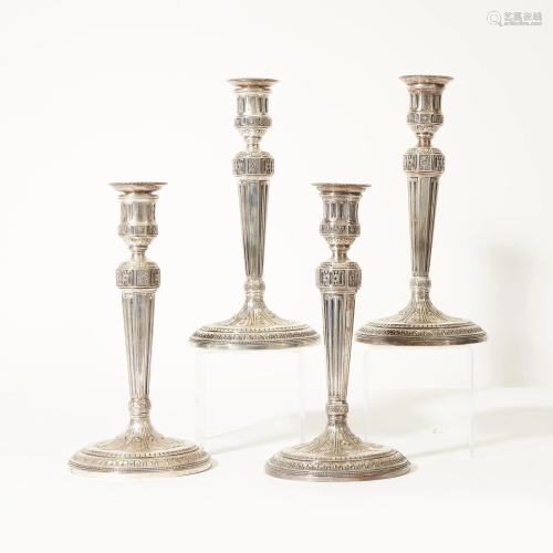 A set of four weighted sterling silver candlesticks,