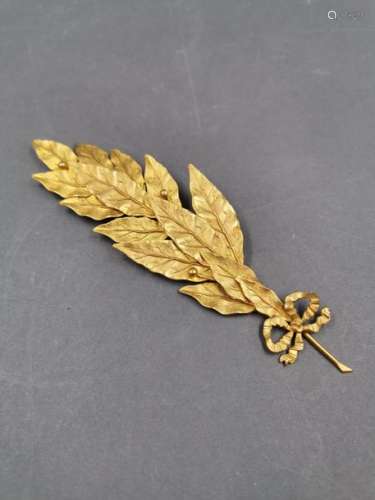 Wrapped laurel branch in metal gilded with gold le…