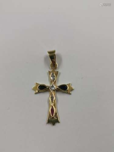 18k yellow gold cross decorated with sapphires, ru…