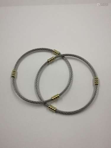 Double bracelet in steel cable and 18k yellow gold…