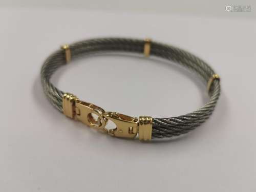 Stainless steel and 18k yellow gold cable bracelet…