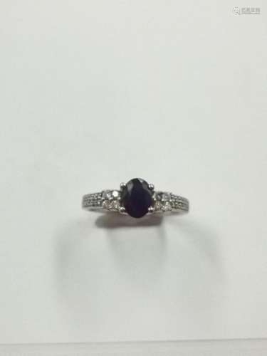 Diamond paved ring in 18k white gold with a facett…