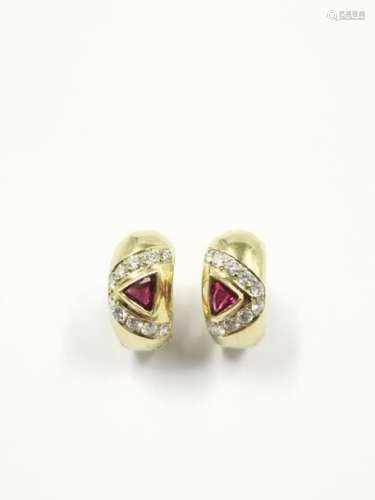Pair of creoles in 18k yellow gold surmounted by a…