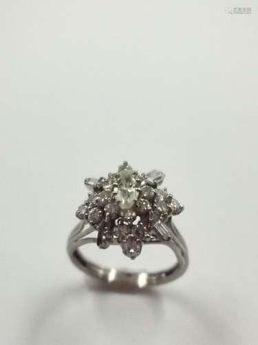 Flower ring in 18k white gold richly paved with di…