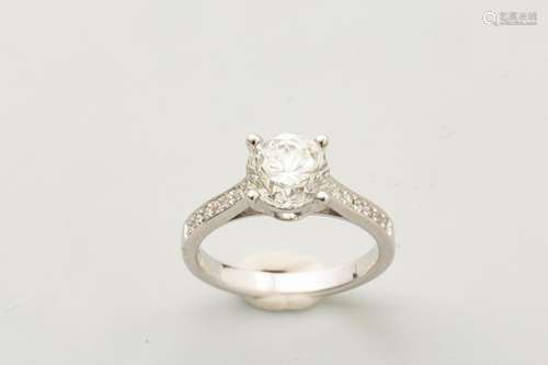 Solitaire ring in 18k white gold surmounted by a d…