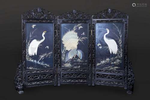 A THREE FOLD EMBROIDERED SILK AND HARDWOOD SCREEN PANEL