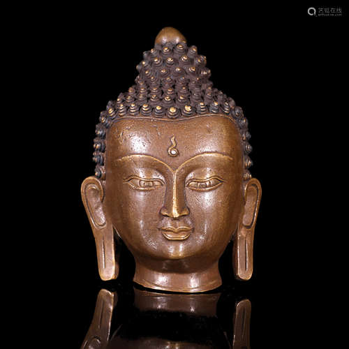 A Bronze Buddha Head Statue