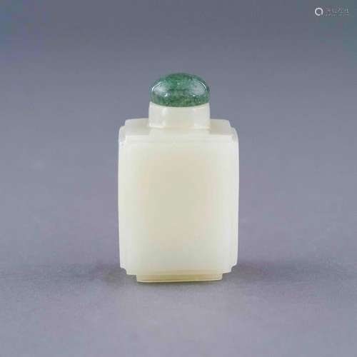 A CARVED WHITE JADE SNUFF BOTTLE