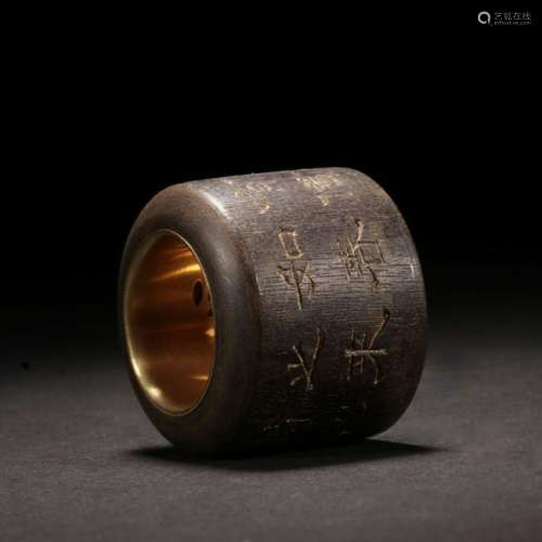A CHINESE CARVED ALOESWOOD THUMB RING INLAID WITH