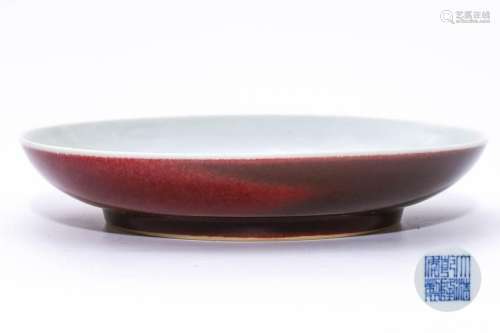 A CHINESE RED GLAZED PORCELAIN PLATE