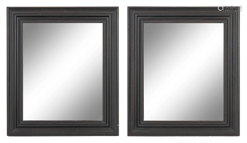 A Pair of Flemish Style Ebonized Ripple Molded Mirrors