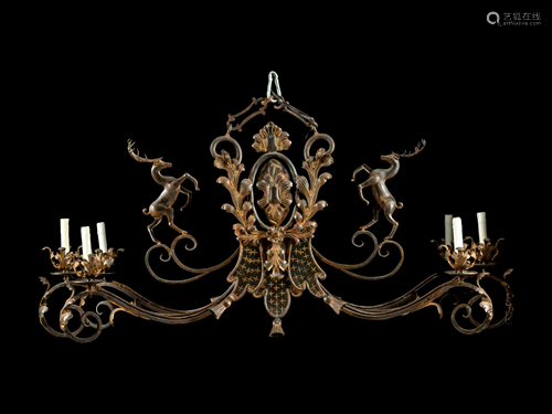 A Wrought Iron and Ta´le Six-Light Chandelier