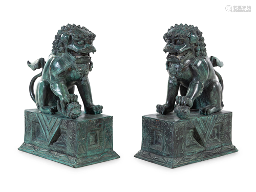 A Pair of Patinated Cast Metal Temple Guardians