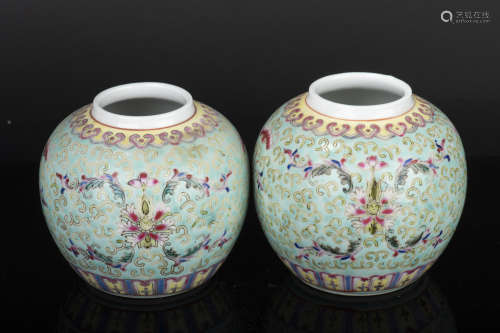 PAIR OF FAMILLE ROSE TURQUOISE GROUND 'SHOU' JARS WITH COVERS