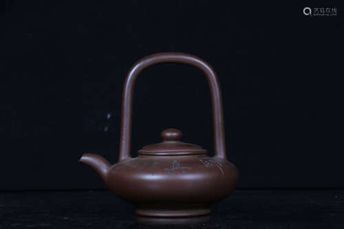 YIXING ZISHA COMPRESSED 'INSCRIPTION' TEAPOT WITH LIFTING HANDLE